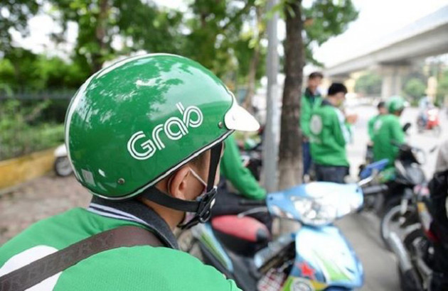 Grab tăng giá cước sau khi thâu tóm Uber - Ảnh 1.