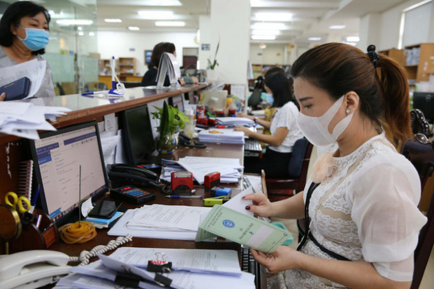 Tinh giản biên chế: Bộ máy không còn phình ra nhưng vẫn chưa tương xứng với đầu tư - Ảnh 1.