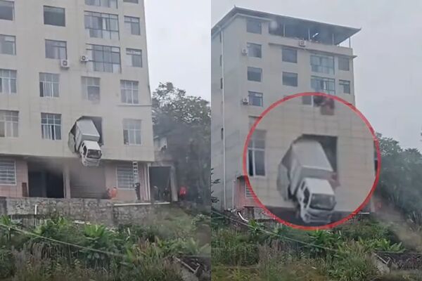 Xe tải đâm xuyên tường tầng 2 tòa nhà, hình ảnh đầu xe mắc kẹt giữa không trung gây sốc - Ảnh 1