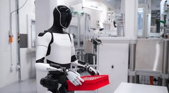 Bên trong phòng thí nghiệm robot của Tesla: Nhân viên phải mặc đồ chuyên biệt, đeo gần 20kg thiết bị trên lưng để ghi hình - Ảnh 1