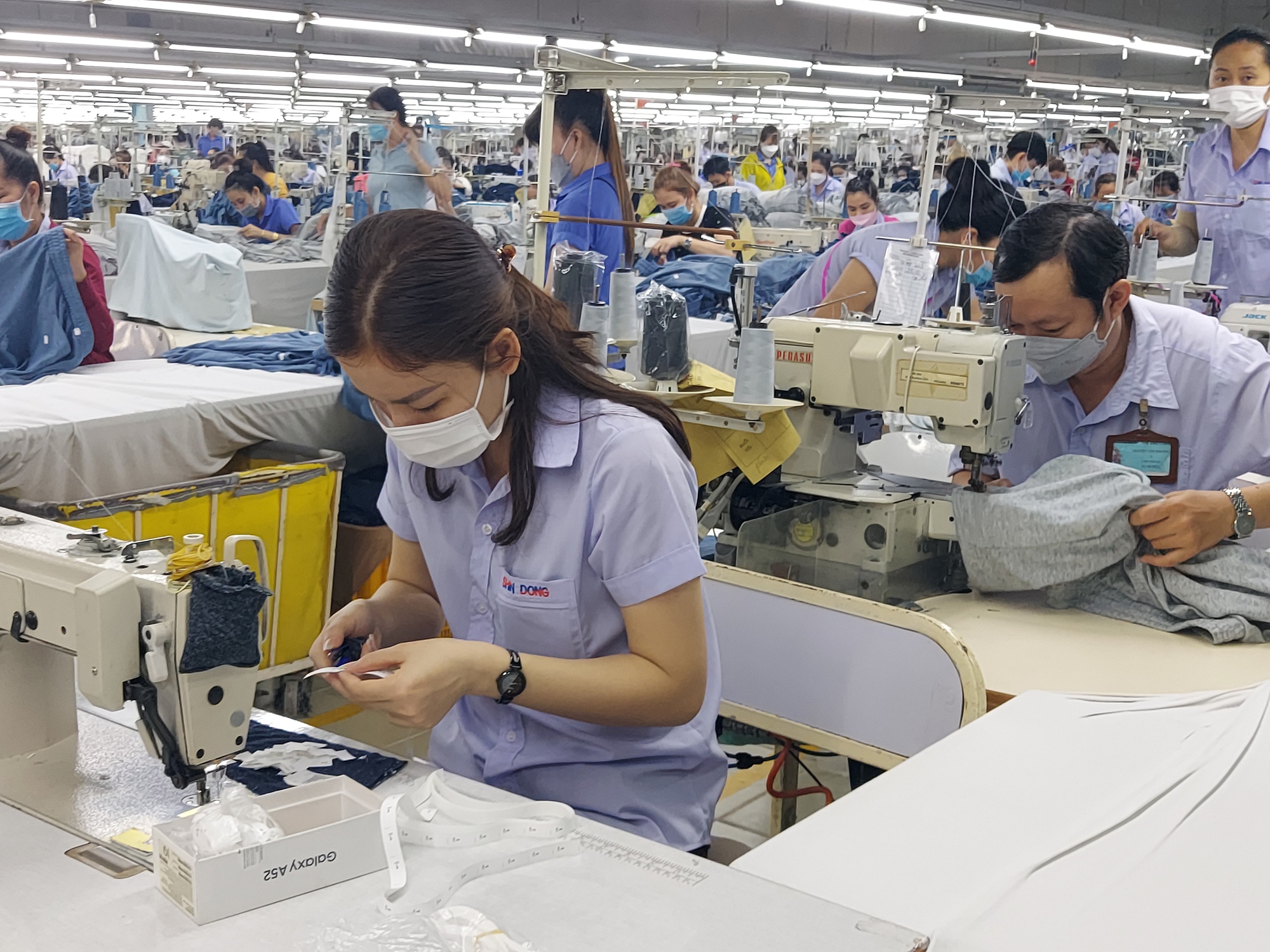 Chi nhánh doanh nghiệp ở nhiều vùng, áp dụng mức lương tối thiểu thế nào? - Ảnh 1