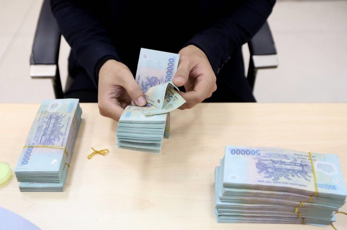Doanh nghiệp gửi hơn 8,35 triệu tỷ vào ngân hàng - Ảnh 1