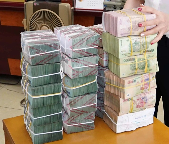 Đổi tiền mới có thể bị phạt nặng - Ảnh 1