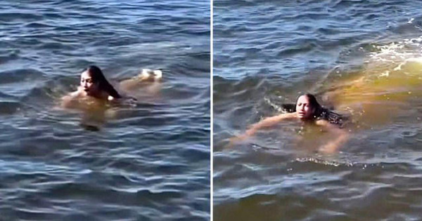 "Thủy quái" lặng lẽ bơi ngay sát người phụ nữ đang tắm sông, chỉ vài chục giây khiến mạng xã hội xôn xao
