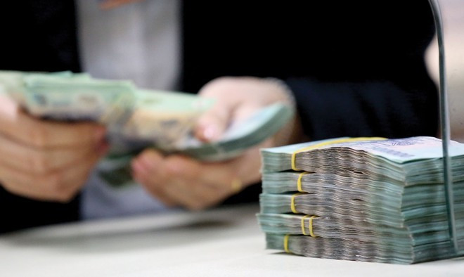 Ngân hàng dồn dập rao bán nợ trước Tết - Ảnh 1