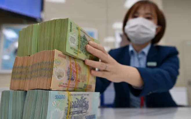 Một số ngân hàng hạ lãi suất cho vay - Ảnh 1