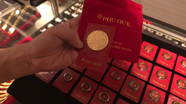 Giá vàng lình xình, liệu có thể quay lại vùng đỉnh 5.600 USD/ounce? - Ảnh 1