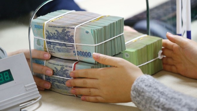 Ngân hàng tăng “bộ đệm” dự phòng: Hy sinh lợi nhuận để phòng ngừa nợ xấu - Ảnh 1